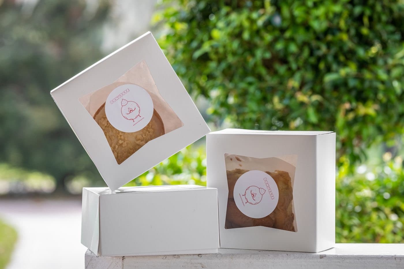 White window patch boxes with die-cut apertures showing the product