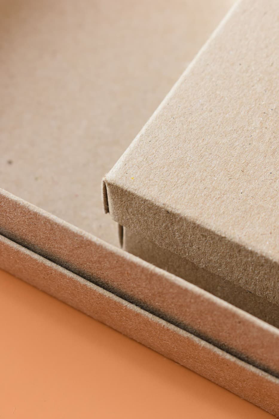 Close detail of wrapped rigid box edges and corner construction